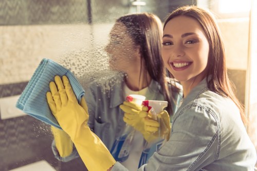 Local technician performing deep sofa cleaning in a residential property